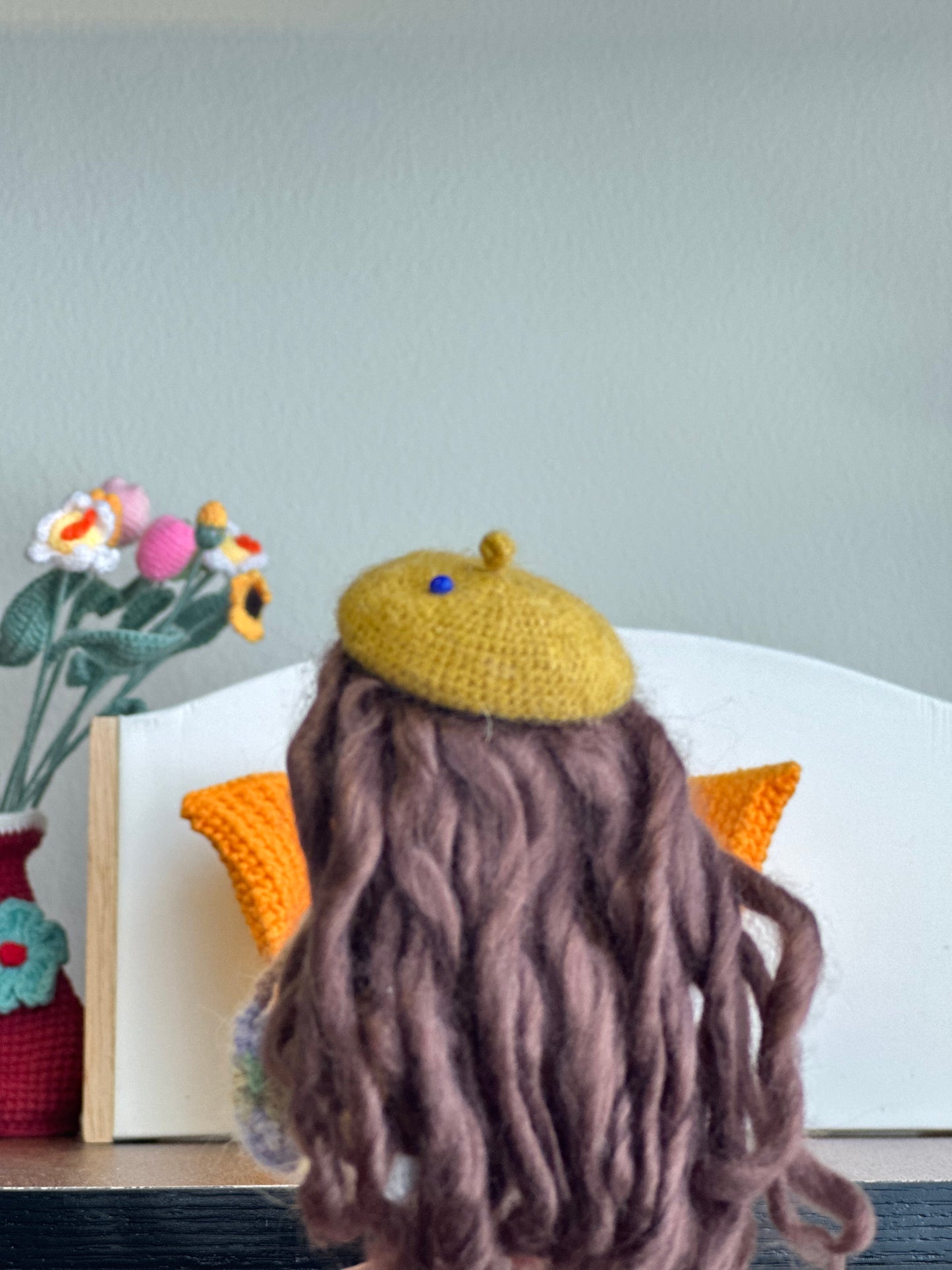 Crochet Doll on Orange Sofa