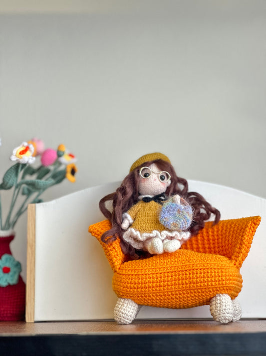 Crochet Doll on Orange Sofa