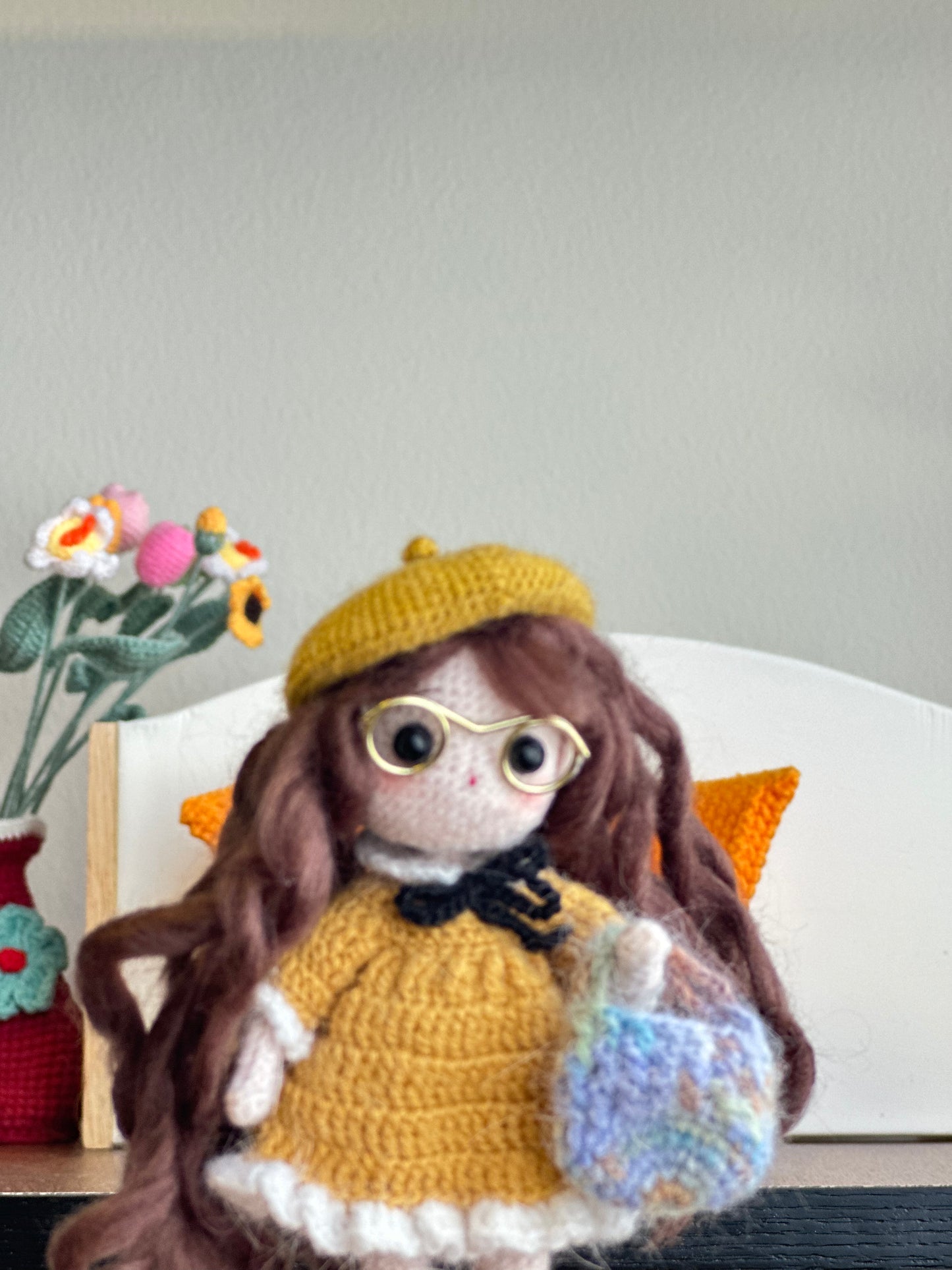 Crochet Doll on Orange Sofa